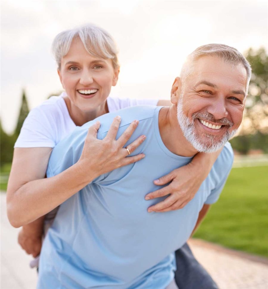 Smiling couple in their fifties enjoying time outdoors together